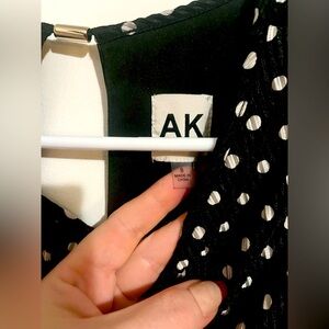 A beautiful Anne Klein dress with belt attached to the dress. Size S